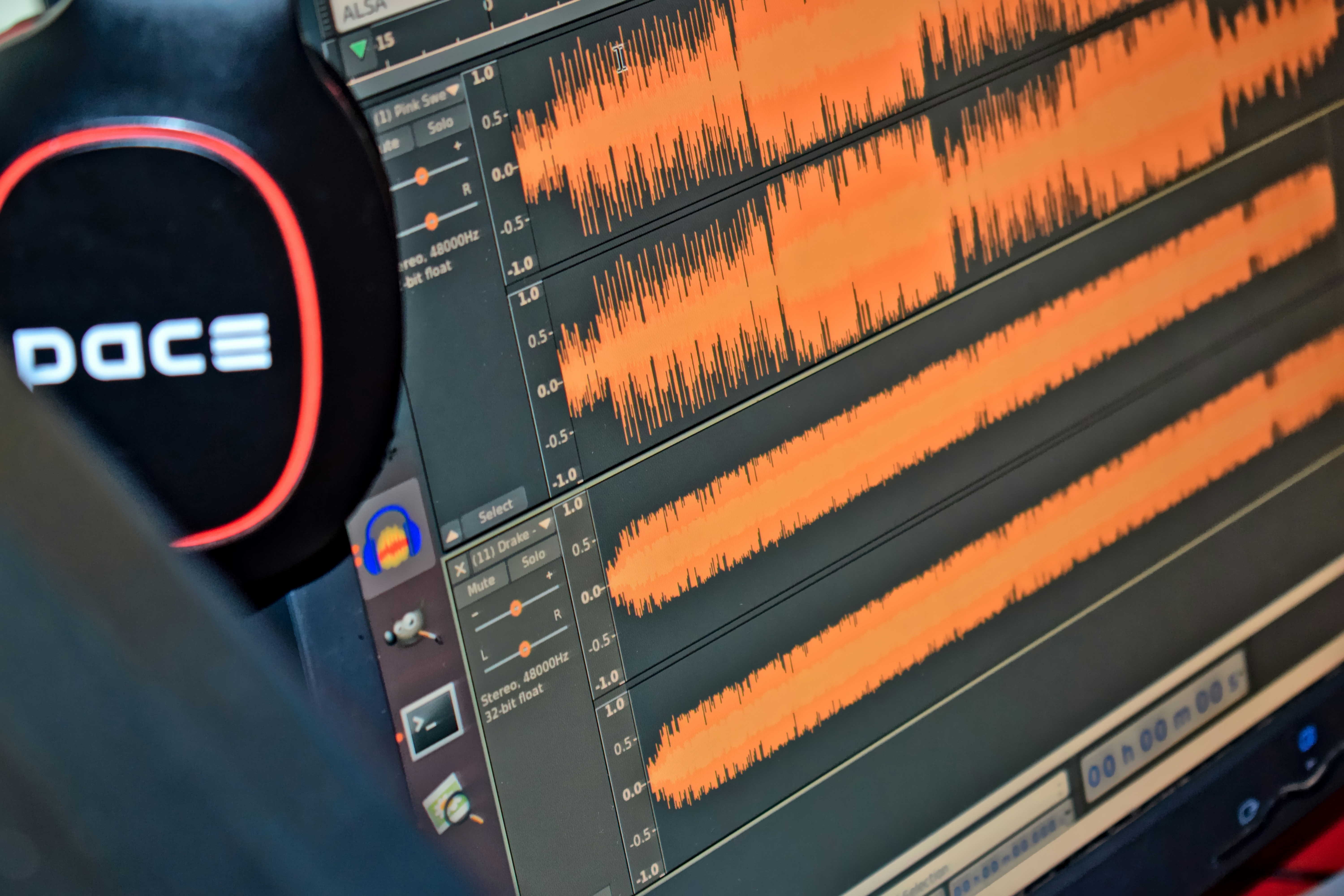 Audio waveform with visible background noise before and after noise reduction processing